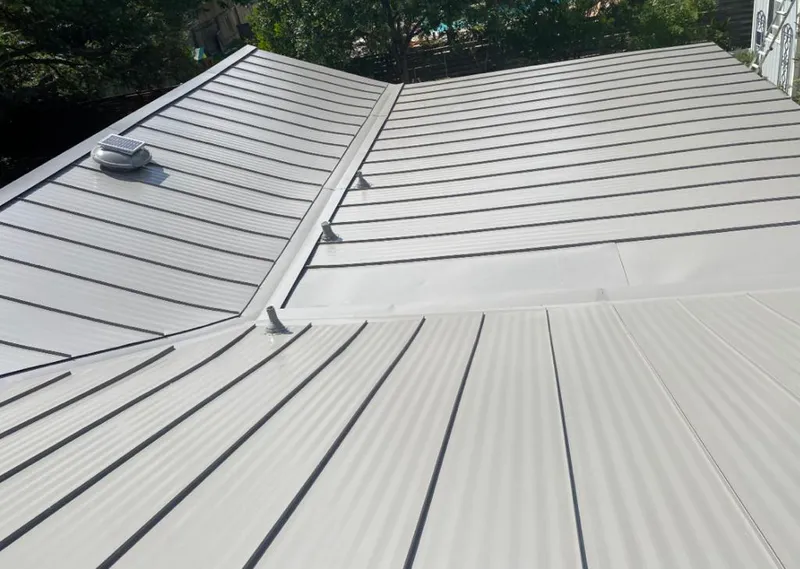 Solar attic fan installed on a metal roof for Roof Ventilation in St. Clair Shores